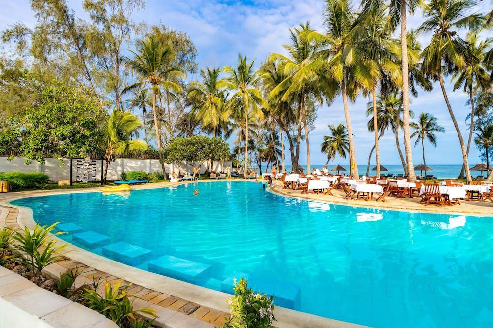 Luxury beachfront resort pool overlooking the ocean in Diani Beach